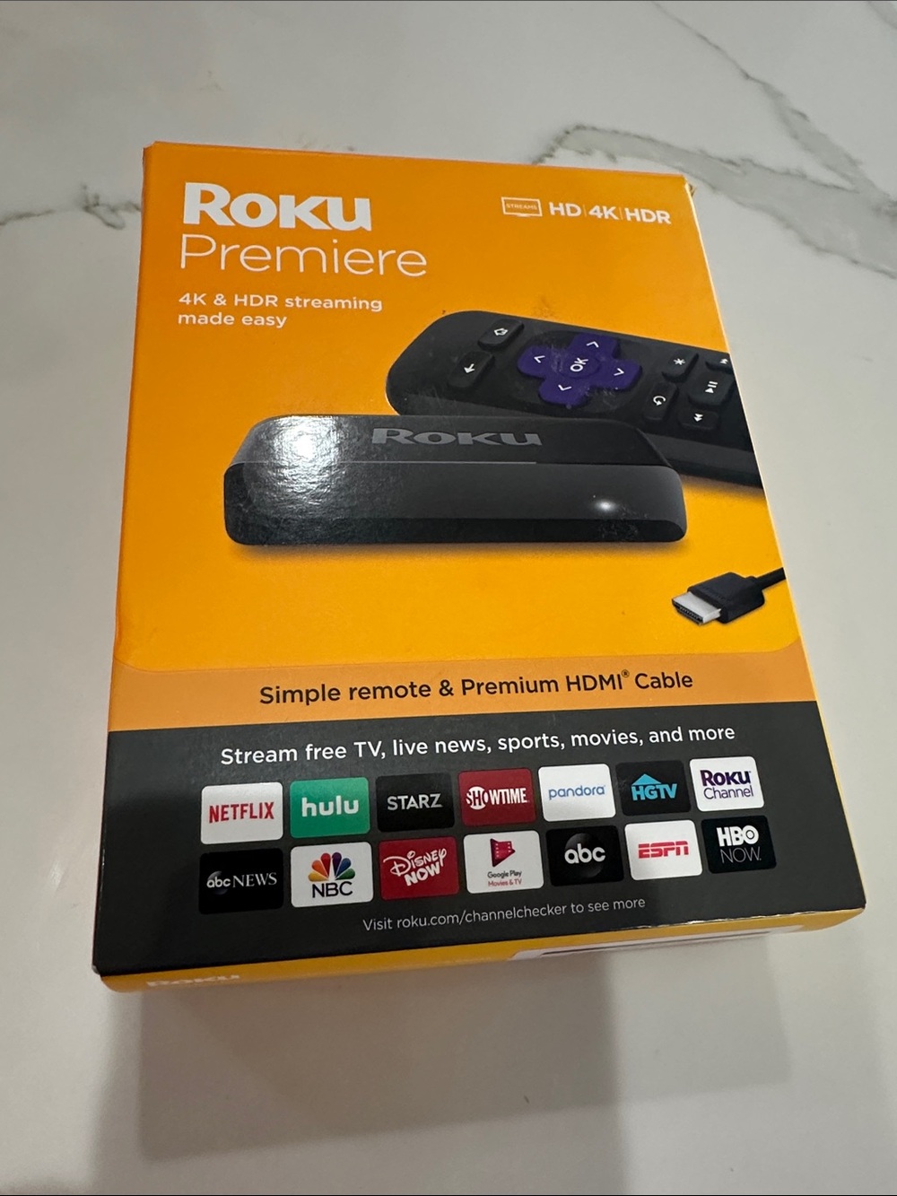 Roku Premiere Streaming Player with Orange Packaging and Black Device